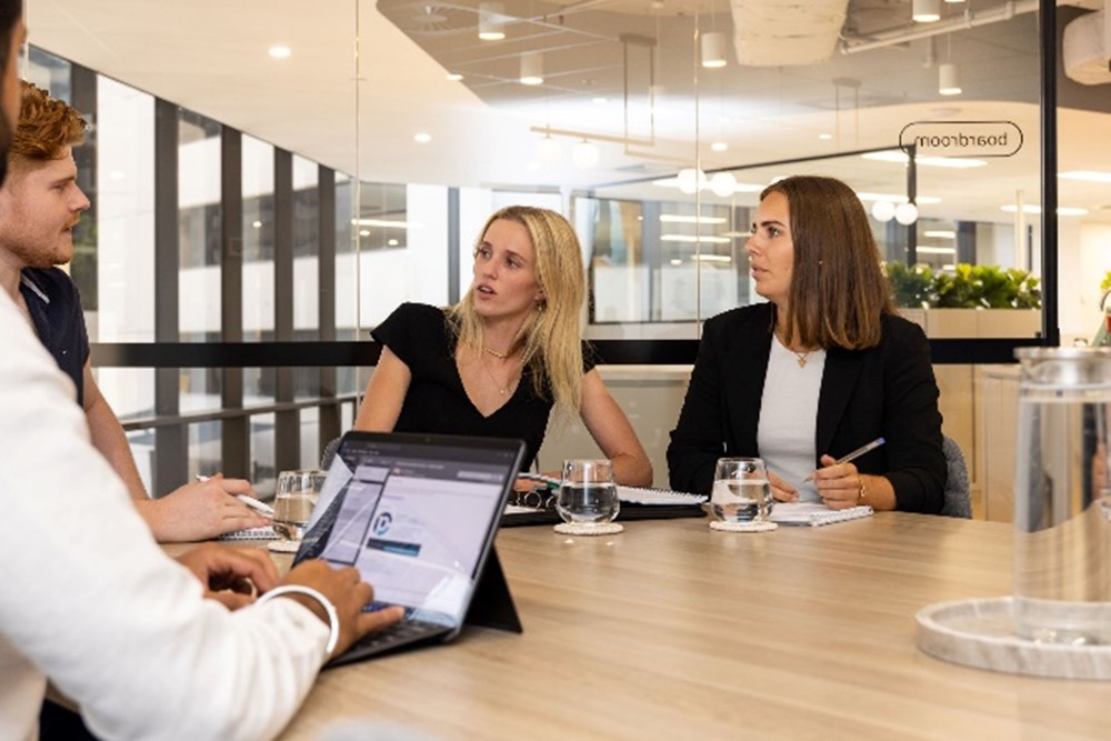 employees in meeting discussing